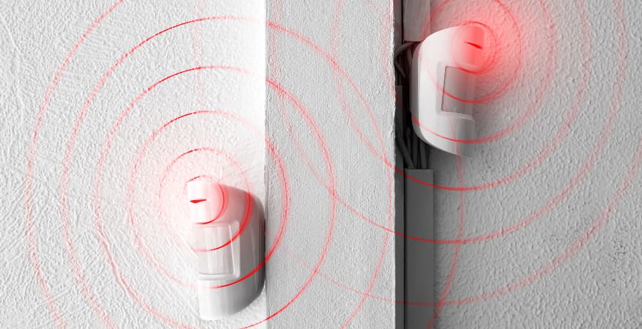 Motion sensors attached to walls in a home